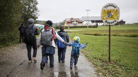 Refugee family crossing into Germany