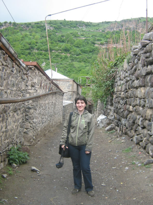 Anna Papyan in the streets of the old part of the village Karahunj