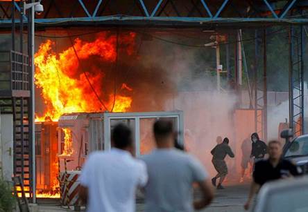 A border crossing between Serbia and Kosovo is set ablaze by hundreds of Serb youths, in Jarinje, on July 27, 2011. Kosovo special police units on July 25 took control of the Brnjak and Jarinje border crossings to enforce a new ban on imports from Serbia in a tit-for-tat move against the embargo imposed by Belgrade since 2008, when Kosovo unilaterally declared its independence. One officer was subsequently killed and four others were hurt in a clash with angry local Serbs and on July 27 most of these elite forces withdrew. AFP PHOTO / STRINGER via Getty Images