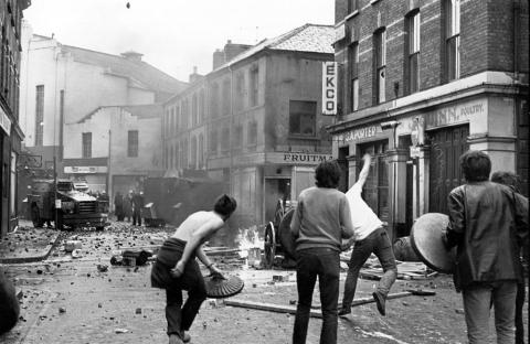 12th August 1969: Protestors petrol bomb an armoured Royal Ulster Constabulary patrol in the streets of Derry during the Battle of the Bogside. (Photo by Peter Ferraz/Getty Images)